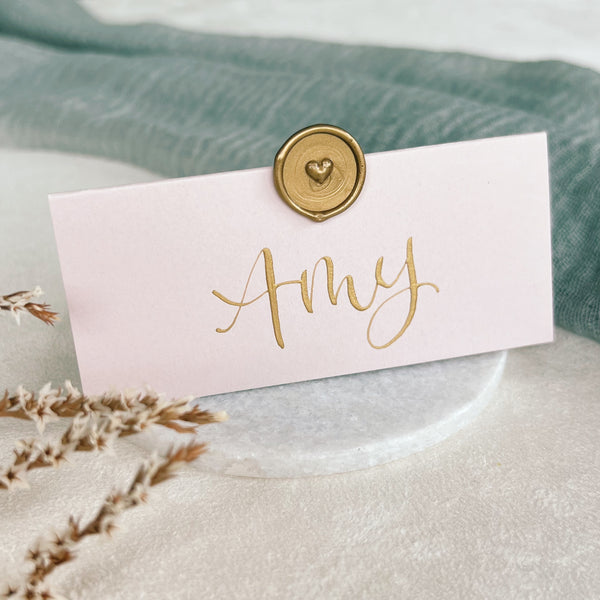 Blush pink place cards with wax seal