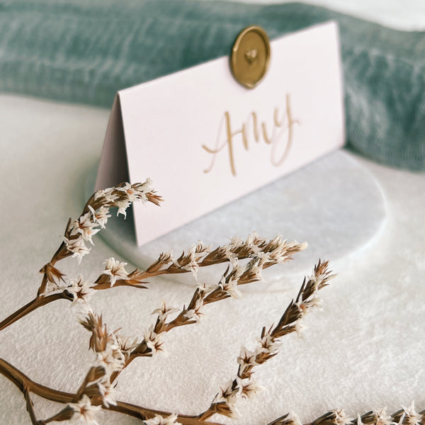 Blush pink place cards with wax seal