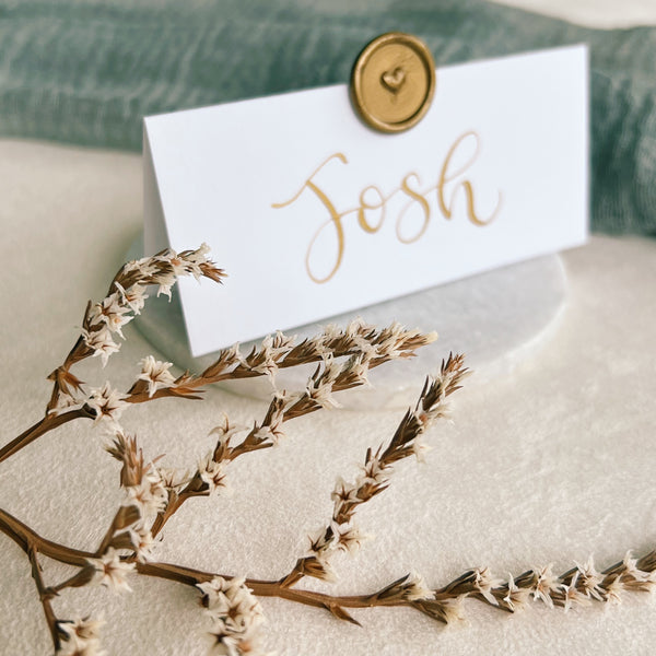 White place cards with wax seal