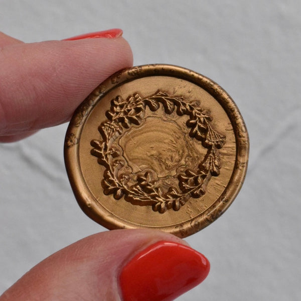 Navy place card with gold wax seal