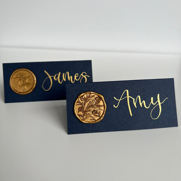 Navy place card with gold wax seal