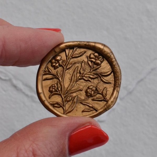 Navy place card with gold wax seal