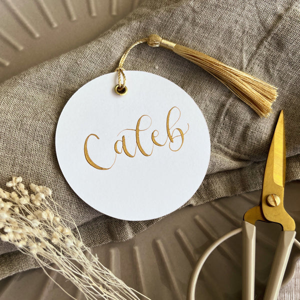 White circle place cards with tassels
