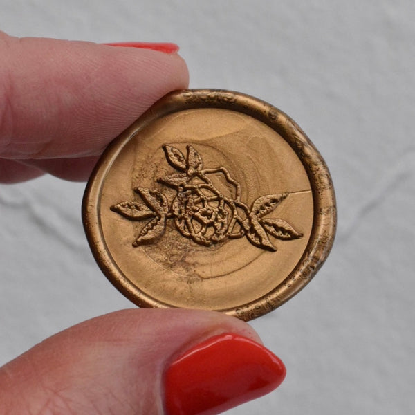 Navy place card with gold wax seal