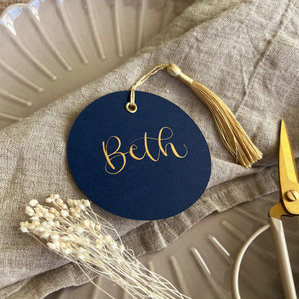 Navy circle place card with tassel