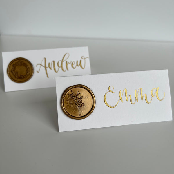 White place card with gold wax seal