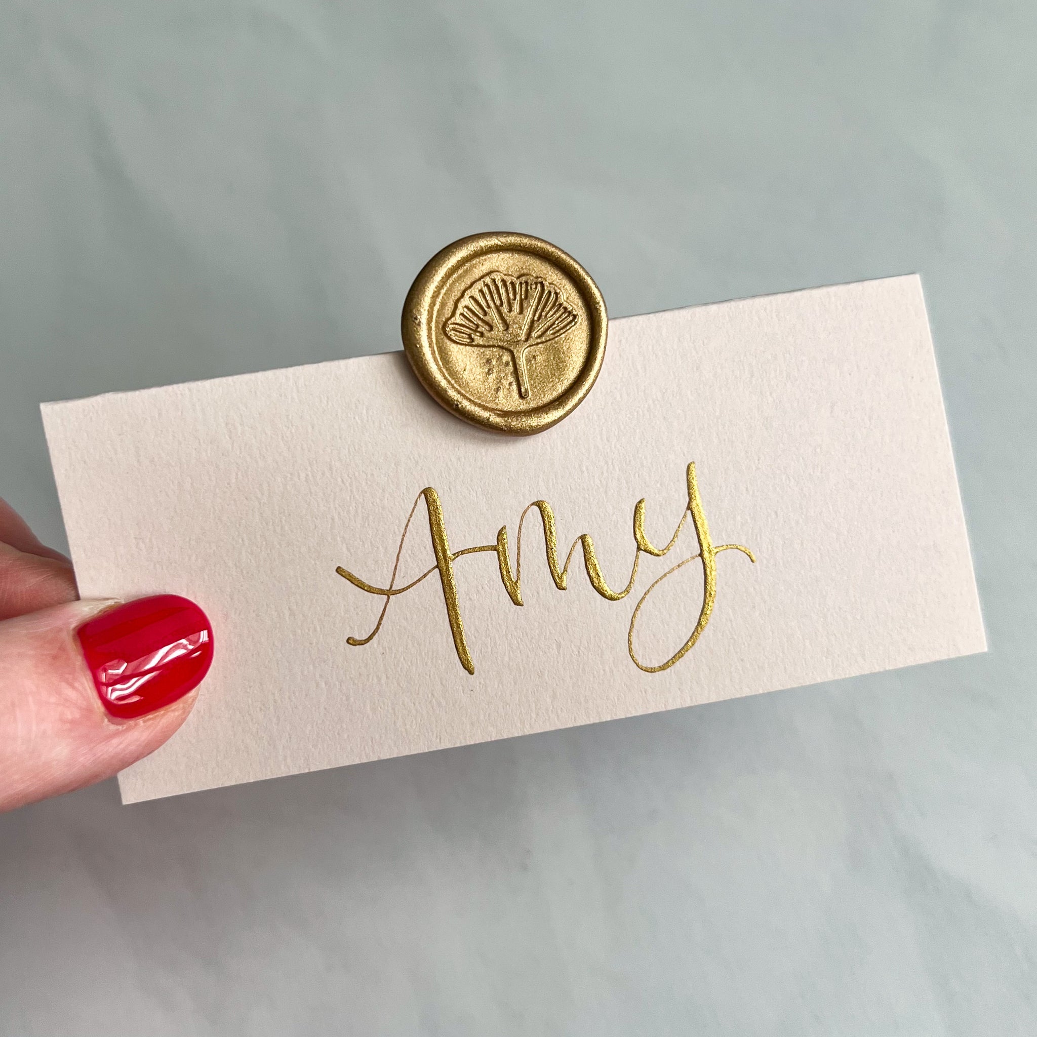Blush pink place cards with wax seal