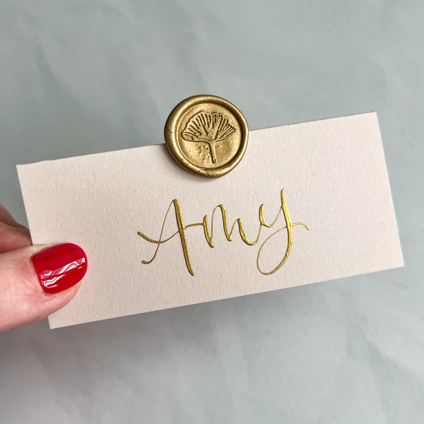 Blush pink place cards with wax seal