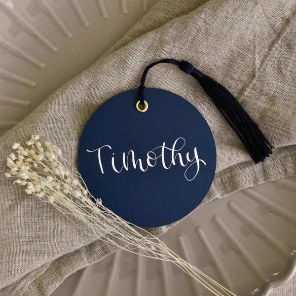 Navy circle place card with tassel