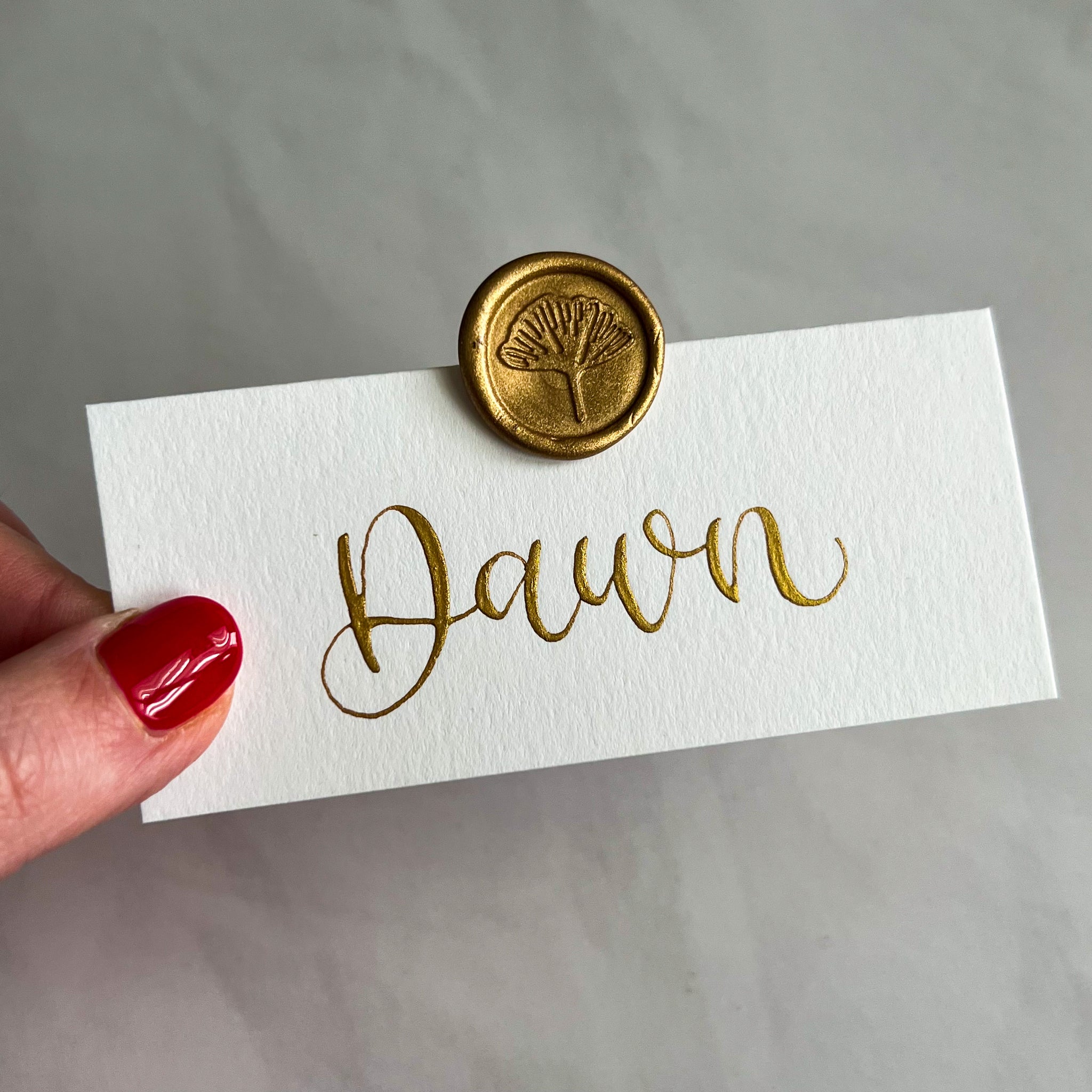 White place cards with wax seal
