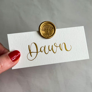 White place cards with wax seal